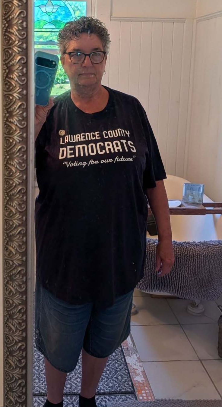 A Lawrence County Democrats member wearing the navy Voting for our future t-shirt